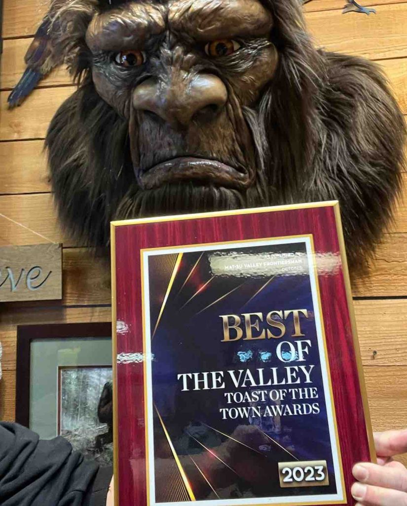 RobRoy displaying the Best Of The Valley plaque with Bigfoot.